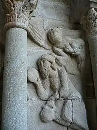 Porche ouest de l'église Saint-Georges - Mur sud : Habacuc, porté par un ange, vient apporter de la nourriture à Daniel dans la fosse aux lions.
