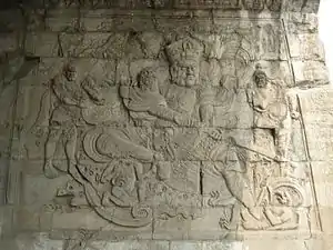 Le Roi du Sud Deva (Virūḍhaka 增長天王). Bas-relief, mur est, plate-forme des Nuages, 1342. Juyongguan. Grande Muraille.