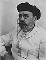 Émile Zola portant un béret.