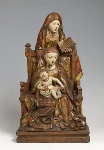 Sculpture où sainte Anne tient un livre et l'Enfant un globe