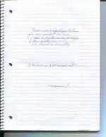 Cahier d'école avec un texte manuscrit écrit en bleu.